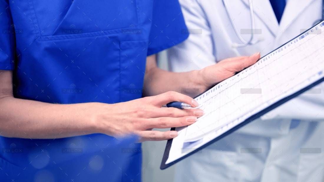 demo-attachment-22-close-up-of-doctors-with-clipboard-at-hospital-PNAWFWS