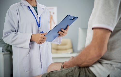 Medical practitioner asking patient questions from the list